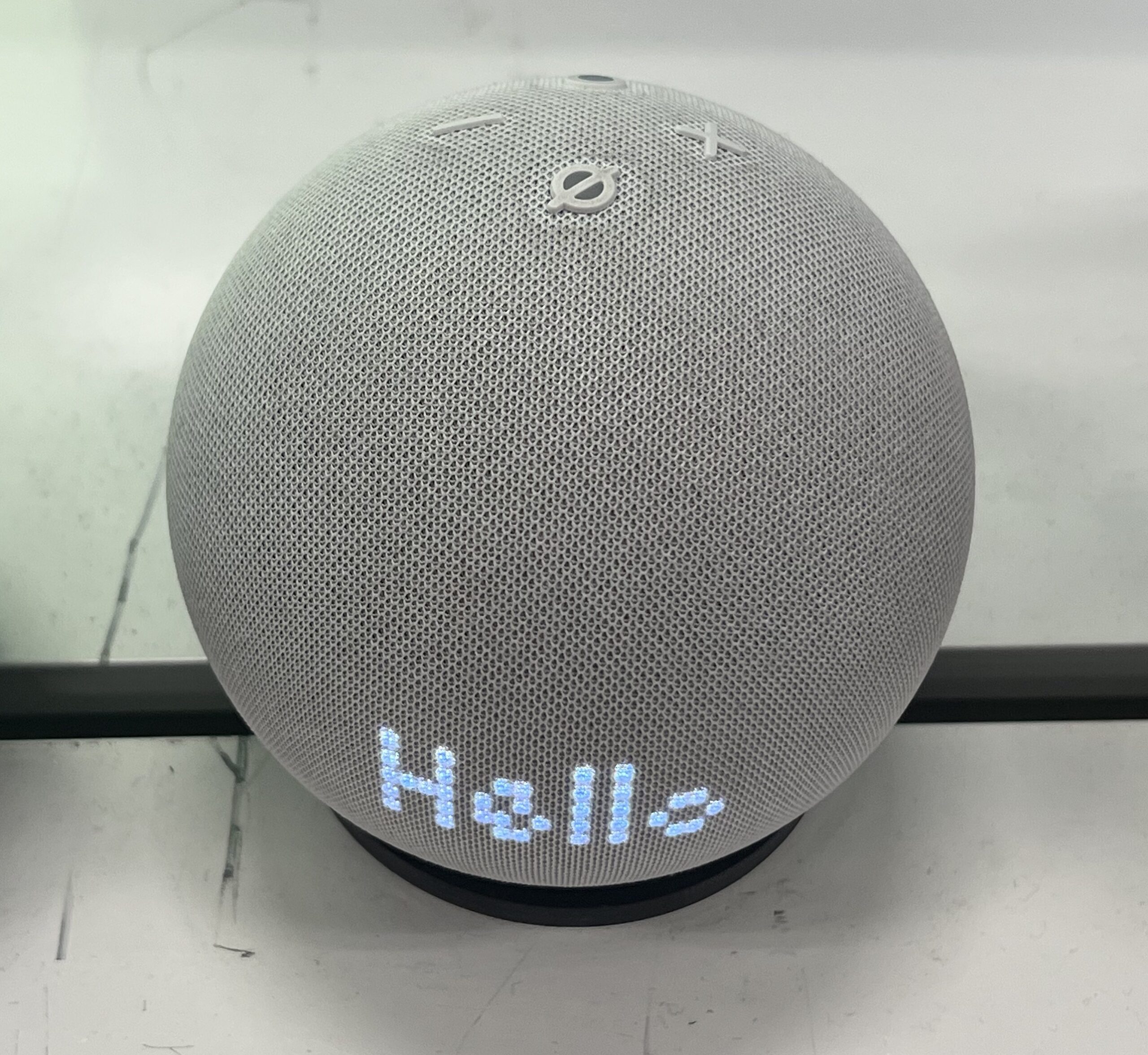 Amazon Echo Dot smart speaker responding with a glowing light display
