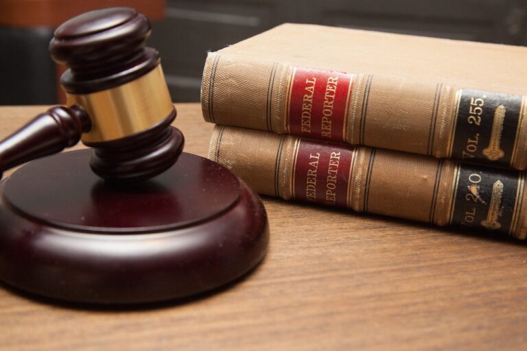 Judges gavel and law books representing Apples lawsuit against OpenAI