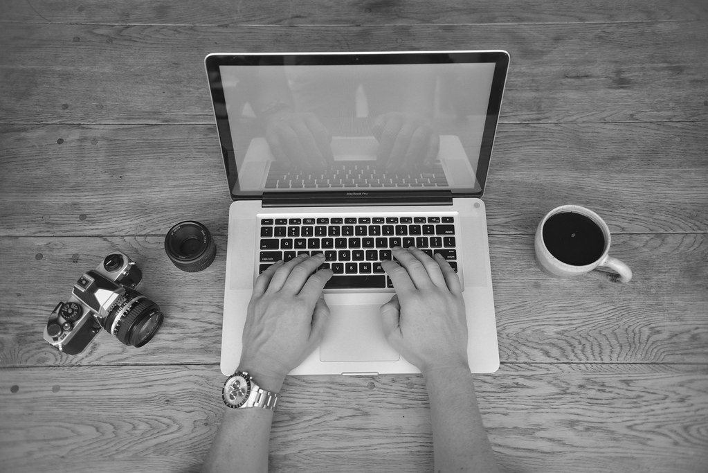 Person working on a laptop with an AI chat assistant open