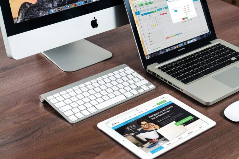 External monitor and MacBook desk setup showing macOS Tahoe display connection