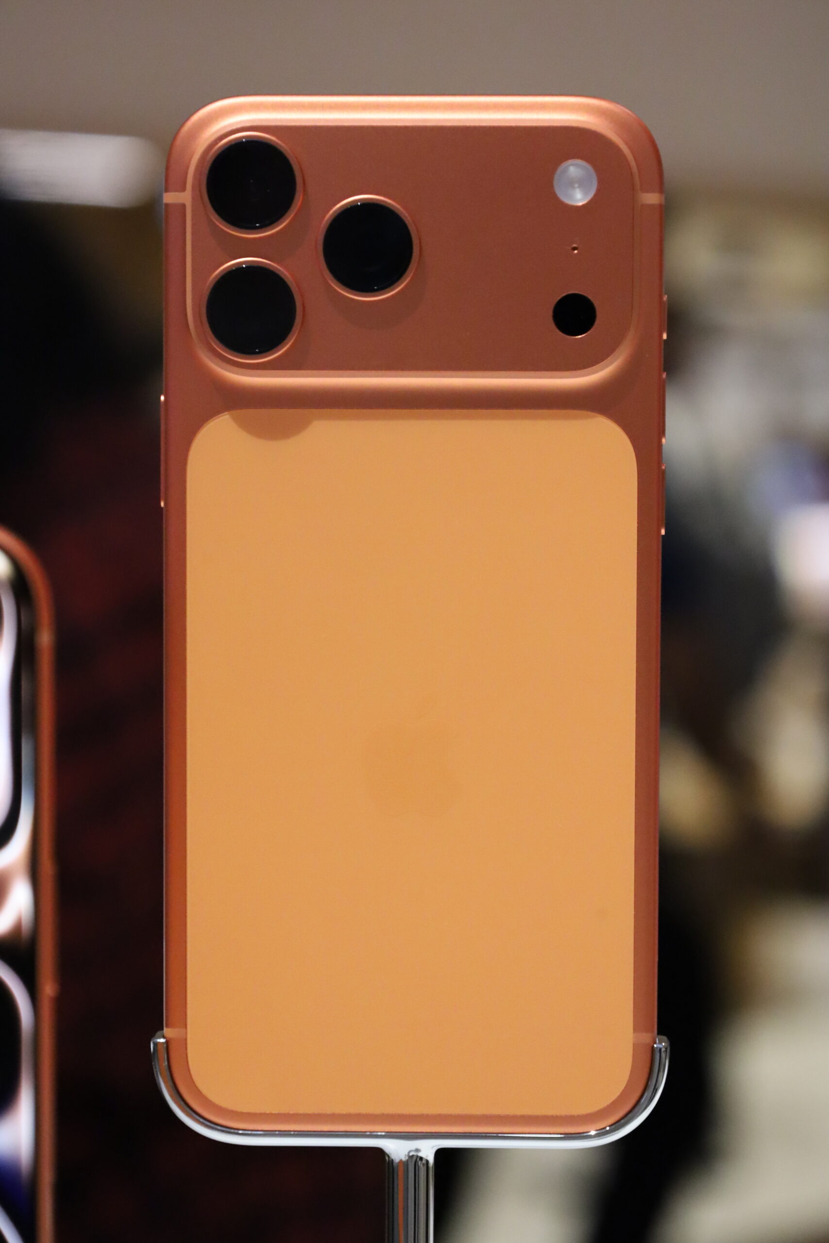 Close-up of an iPhone 17 Pro Max camera module, the kind of A19 Pro-powered iPhone that supports the new Siri voice sliders