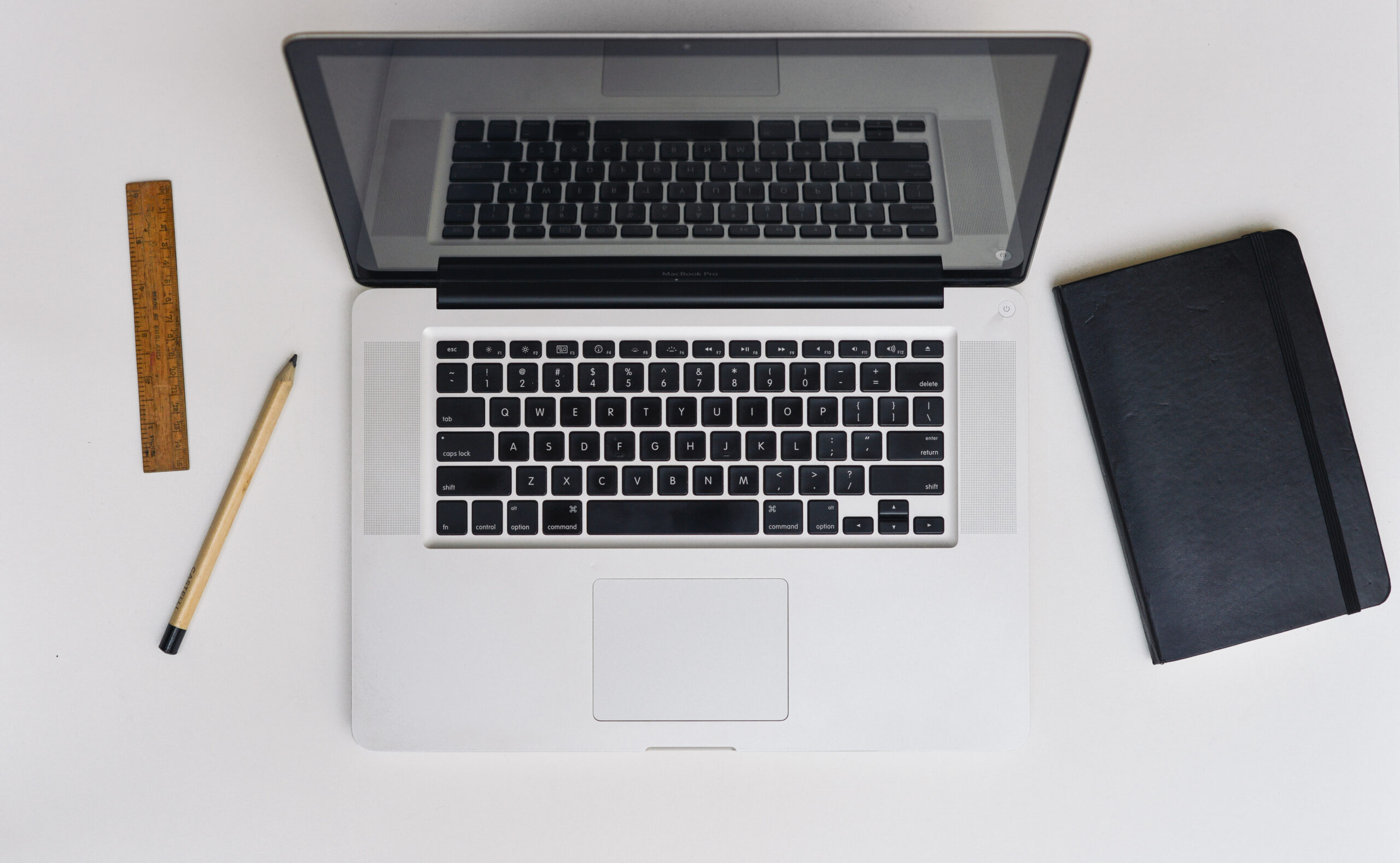 MacBook connected to an external monitor on a desk, a common clamshell mode setup