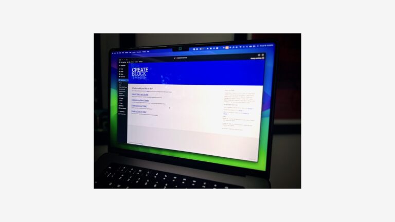 MacBook Pro screen open on a desk, representing Focus mode syncing on Mac
